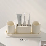 ensemble salle bain moderne brosse dents pot dentifrice distributeur savon blanc crème grain ciment