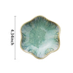plateau bijoux céramique rose clair blanc bleu foncé motif floral moderne élégant anneaux boucles