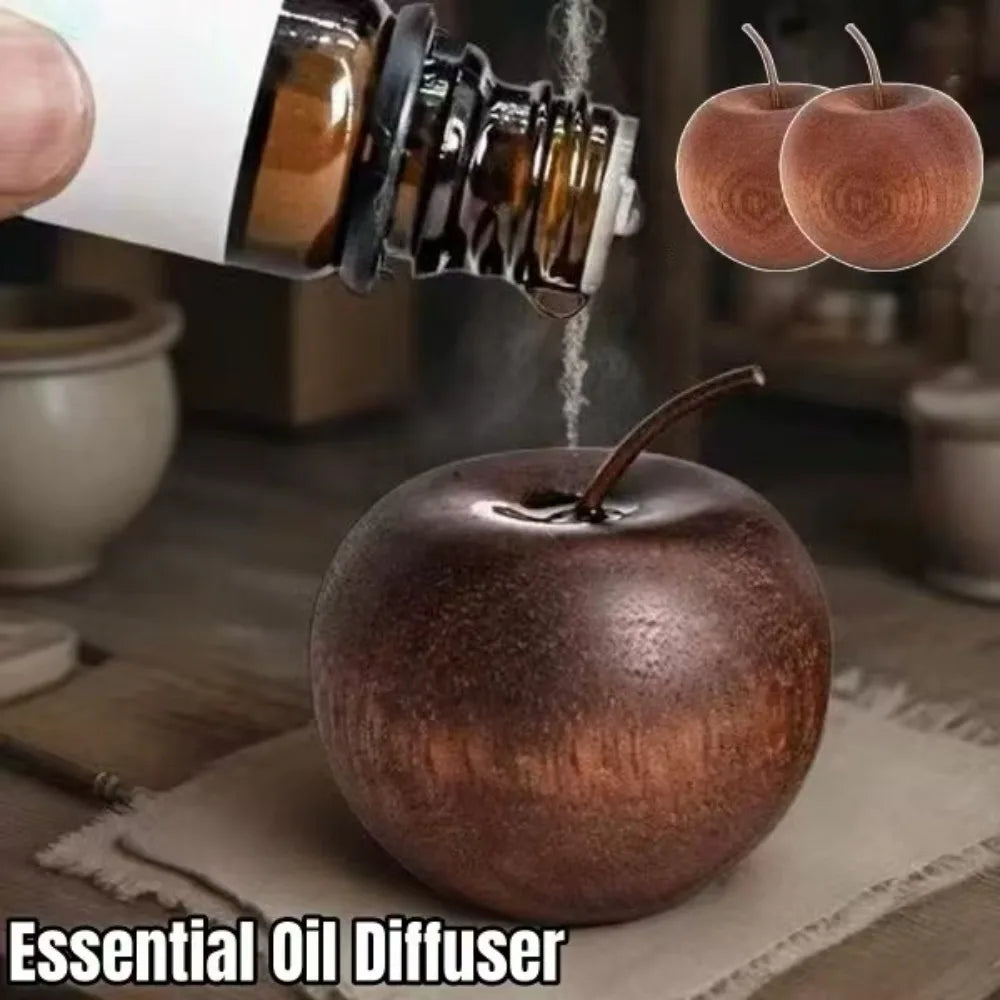diffuseur huiles essentielles forme pomme bois grainé bouteille verre ambrée base bois rouleau décoratif