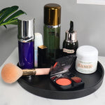 présentoir rond moderne plateau uni vert foncé orange noir maquillage soins parfums cosmétiques table