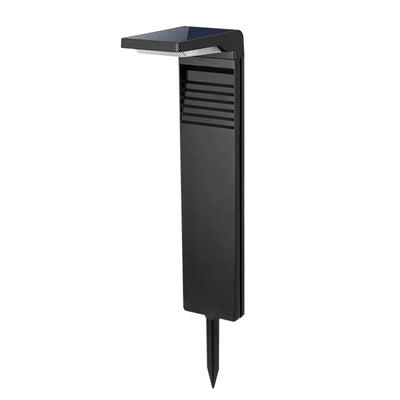 Lampe solaire extérieure sur pied noire dans un jardin