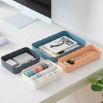 boîtes rangement empilables plastique gris bleu rose blanc modernes minimalistes maison