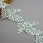 ruban dentelle polyester feuilles stylisées blanc noir vert rose or classique élégant soluble écologique