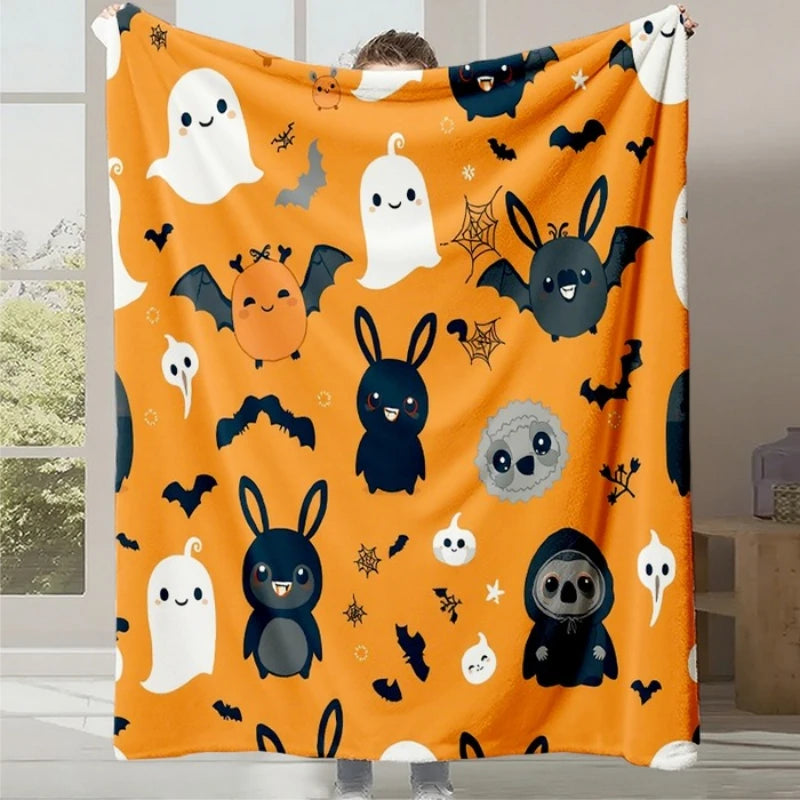 Couverture colorée avec de nombreux personnages de fantômes, chauves-souris et lapins noirs et blancs sur fond orange, créant une ambiance festive pour l'Halloween.