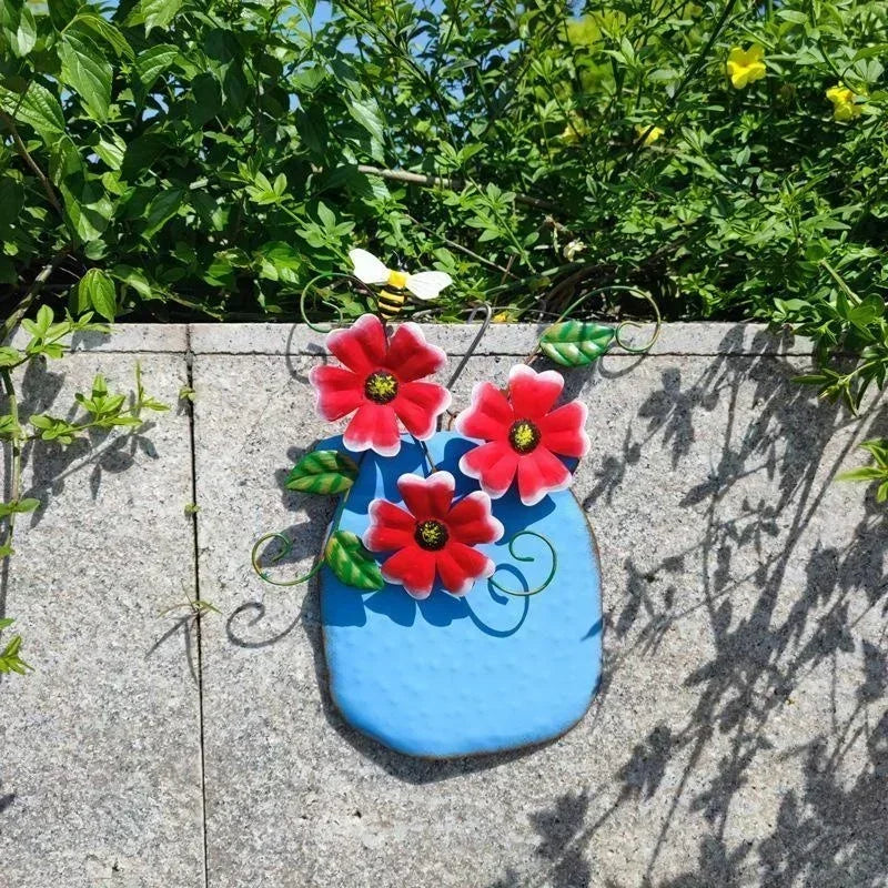 décoration murale artisanale fleurs colorées feuilles vertes abeille bleu jaune orange violet