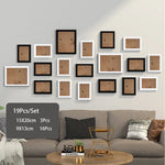 cadres photo bois modernes blancs noirs verre transparent clips inclusion minimaliste mur