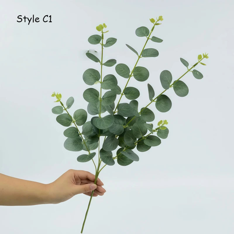 bouquet artificiel feuilles vertes fleurs blanches naturel minimaliste decoration exterieure arrangement floral exposition maison