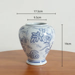 vase porcelaine chinois blanc bleu fleurs feuilles oiseaux géométrique classique floral table decoration