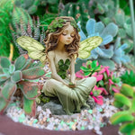 statue fée jardin vert clair trèfle ailes veinées fantaisie natureextérieurintérieurDecorationJardinFéeSculptee