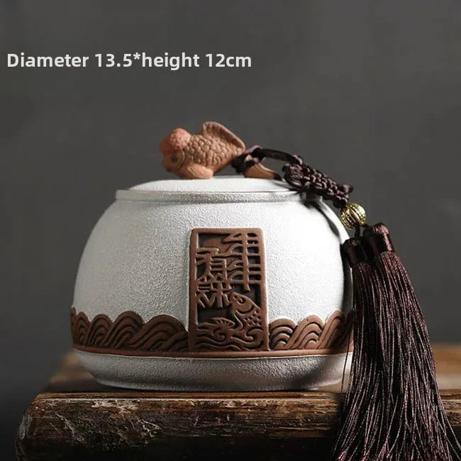 pot thé rouge jaune noir artisanal motifs floraux poisson chaîne pompon hermétique