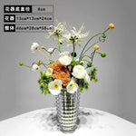 vase moderne argenté brillant fleurs artificielles blanches vertes décoration maison