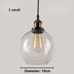 suspension lumineuse industrielle vintage ampoule filament verre transparent noir salon restaurant bar