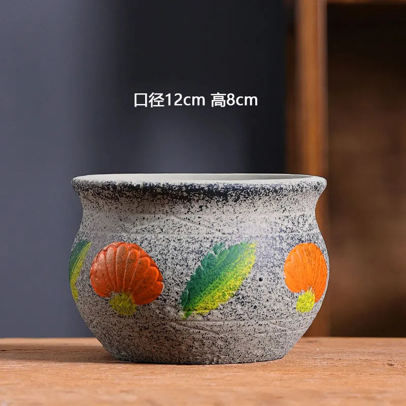 cache pot céramique artisanal méditerranéen couleurs vives motifs texturés plante verte intérieur moderne