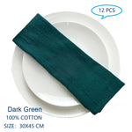 Des serviettes de table en coton de couleur vert foncé, de dimensions 30 x 45 cm, vendues par lot de 12 pièces.