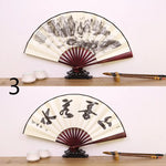 éventail traditionnel artisanal peinture paysage calligraphie nervures bambou tissu beige brun fixations métal 27x48cm