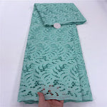 tissu dentelle coton blanc motifs floraux broderie strass robe couture luxe