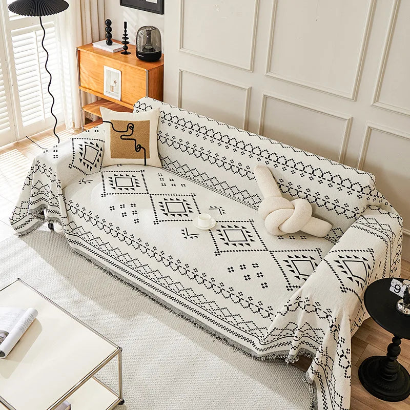 couverture canapé moderne beige noir motif géométrique franges oreiller décoratif ethnique