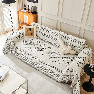 couverture canapé moderne beige noir motif géométrique franges oreiller décoratif ethnique