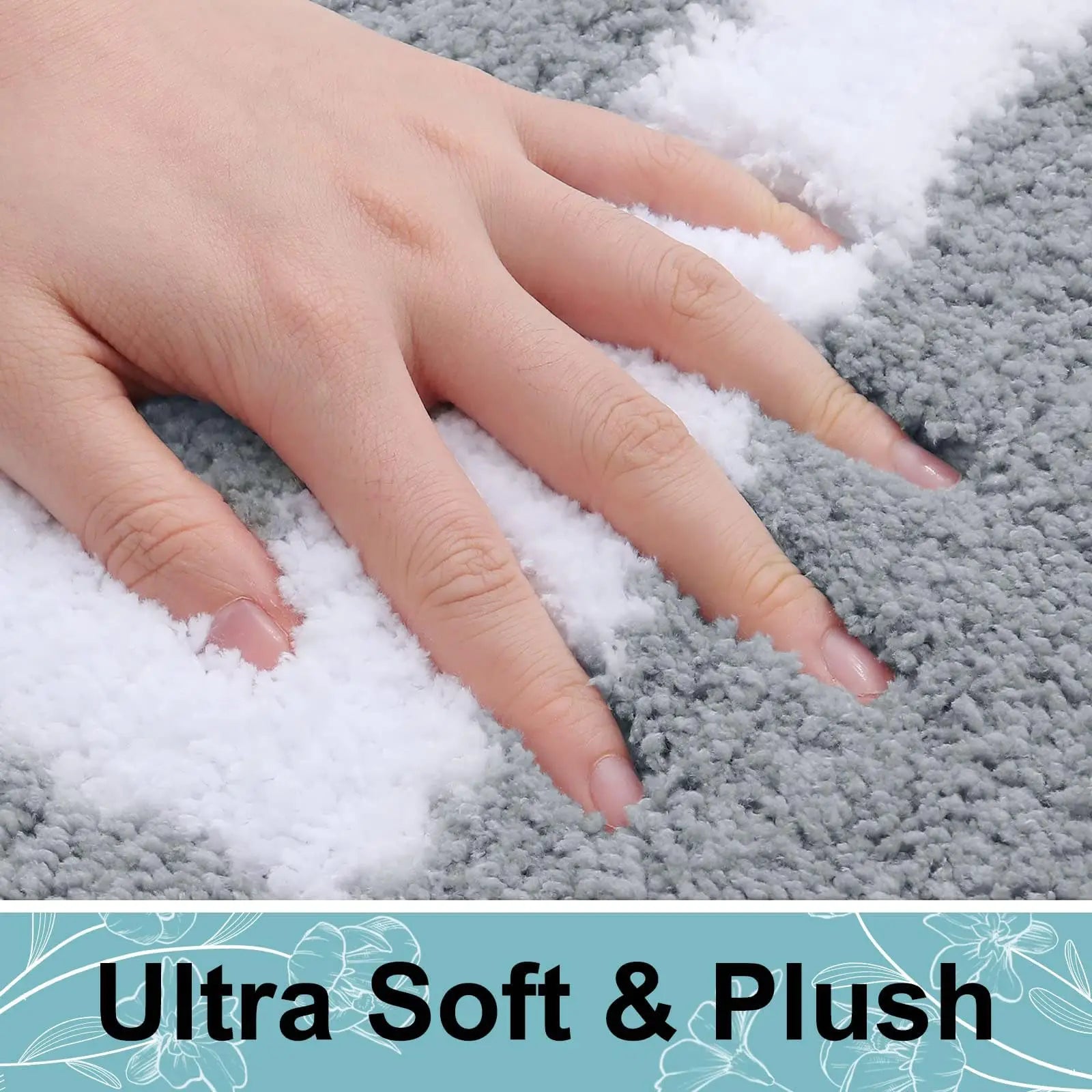 Tapis de bain blanc absorbant placé devant une baignoire moderne