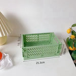 caisse rangement pliable plastique gris vert rose beige blanc grille ventilation moderne minimaliste poignées