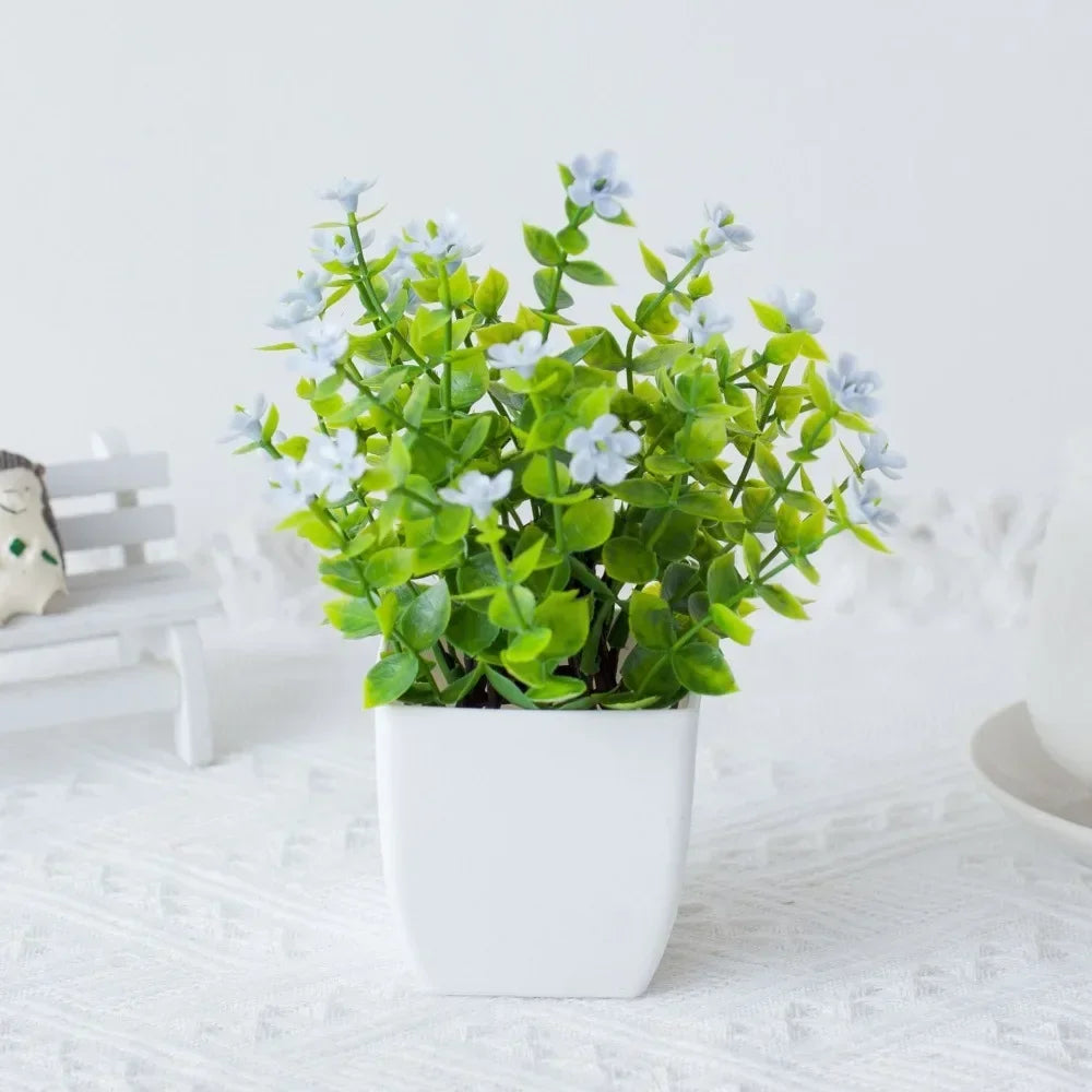décoration extérieure plante artificielle moderne pot carré blanc branches feuilles vertes fleurs violettes minimalisteextérieur