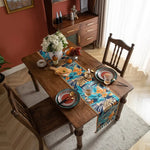 nappe bohème motifs floraux franges couleur bleu foncé orange verte marron rustique