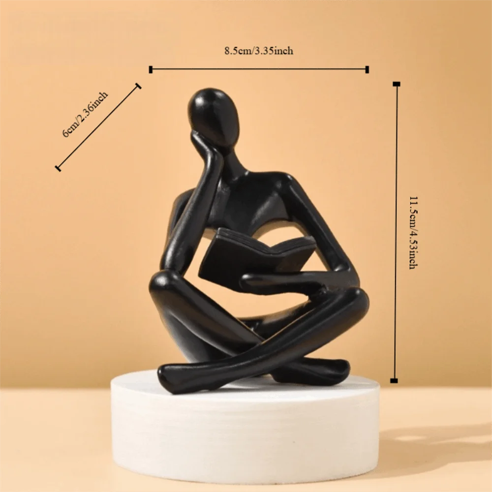 figurine deco moderne or noir blanc personne assise livre socle chambre abstraction minimalisme