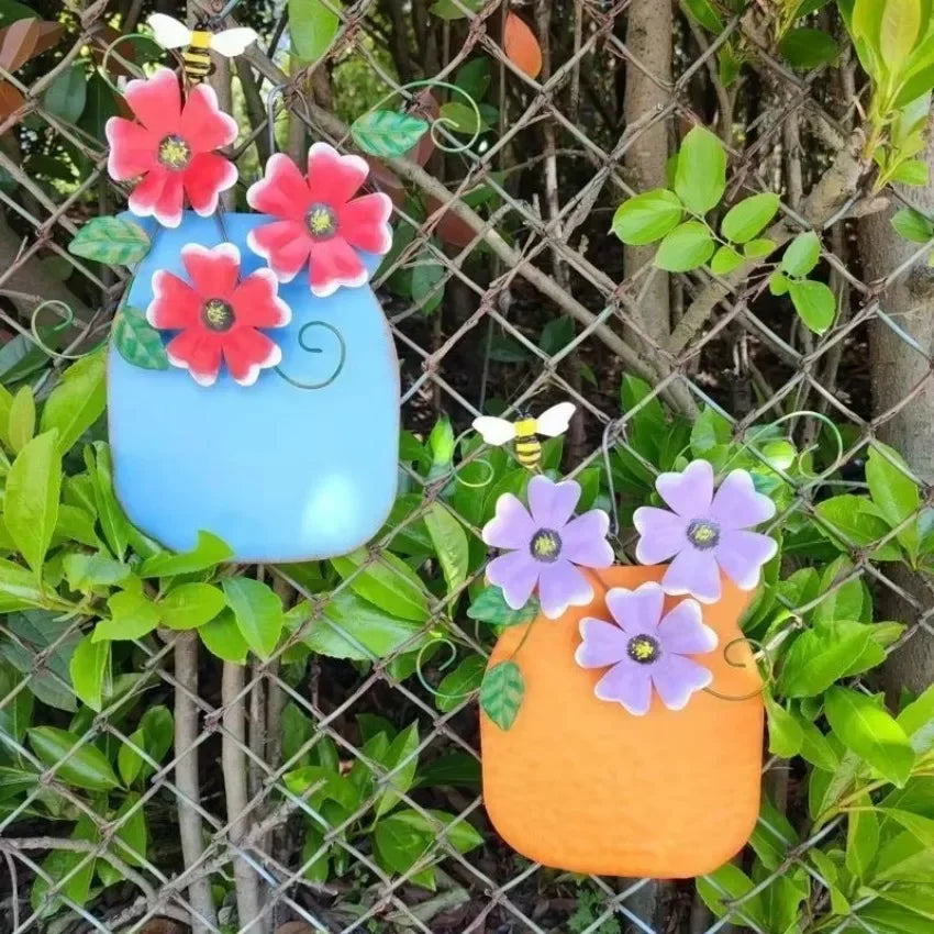 décoration murale artisanale fleurs colorées feuilles vertes abeille bleu jaune orange violet