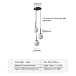 suspension lumineuse moderne or blanc sphères translucides pièces structure métal doré