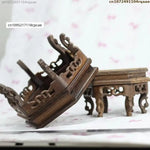 supports bois sculptés vases peints main artisanat traditionnel fleurs oiseaux motifs géométriques vert clair