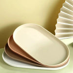 assiettes ovales modernes plastique beige rose blanc dessert vaisselle rangement maison cuisine