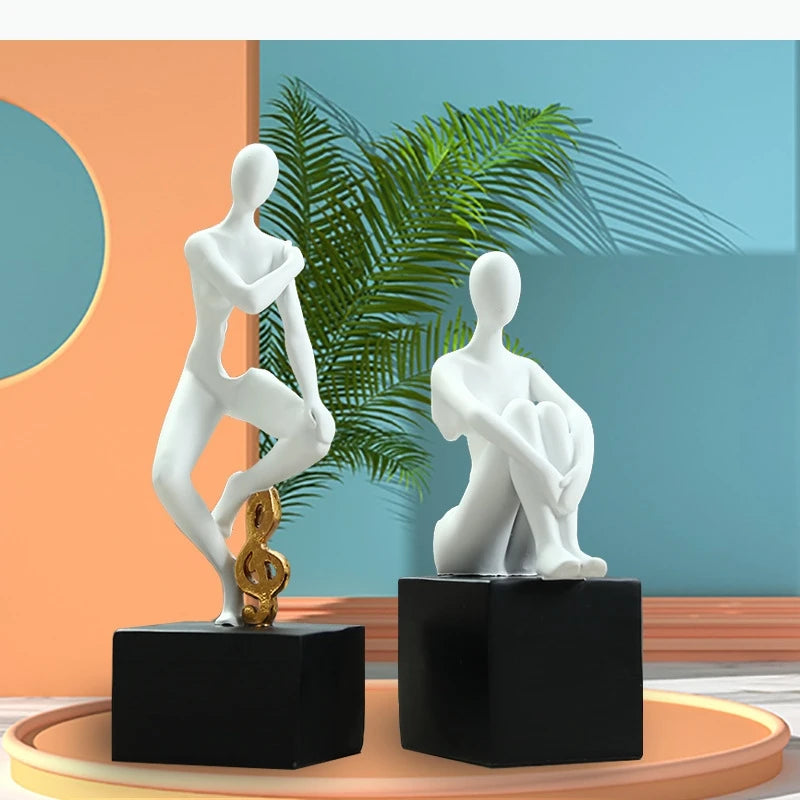 statues décoratives minimalistes figures humaines stylisées blanc noir élément doré moderne abstrait