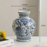 vase porcelaine chinois blanc bleu fleurs feuilles oiseaux géométrique classique floral table decoration