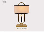 lampe table tissu texturé moderne asiatique pompon abatjour opaque métal noir