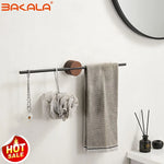 porte serviettes mural moderne acier inoxydable finition brossée noir bois texture naturelle serviette tissu