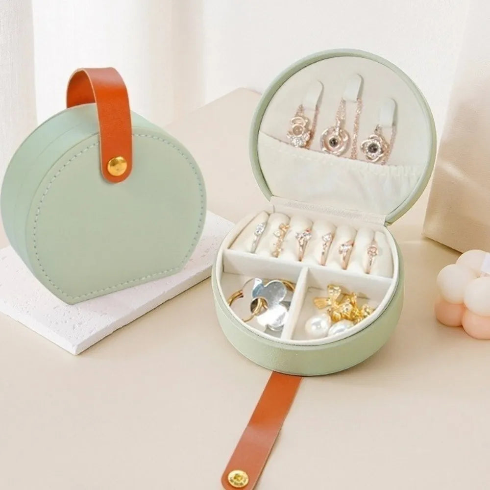 boîte bijoux simili cuir poignée compartiments bagues oreilles colliers vert pastel moderne élégante protection