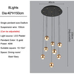 suspension lumineuse contemporaine noir doré sphères métalliques brillantes éclairage intérieur maison