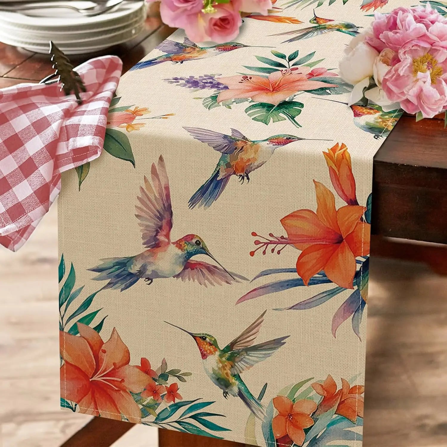 Nappe florale élegante avec motifs de colibris voltigeants et de fleurs colorées.