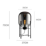 lampe sol moderne transparente ampoule filament noir gris fumé led verre minimaliste