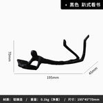 statuette moderne minimaliste or noir texture rugueuse stylisée acrobatie décoration pièce ornement figure