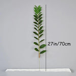 plantes artificielles branches vertes feuilles simples extérieur moderne pot blanc exposé