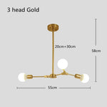 suspension lumineuse moderne or noir sphères translucides scandinave structure métallique pince suspension
