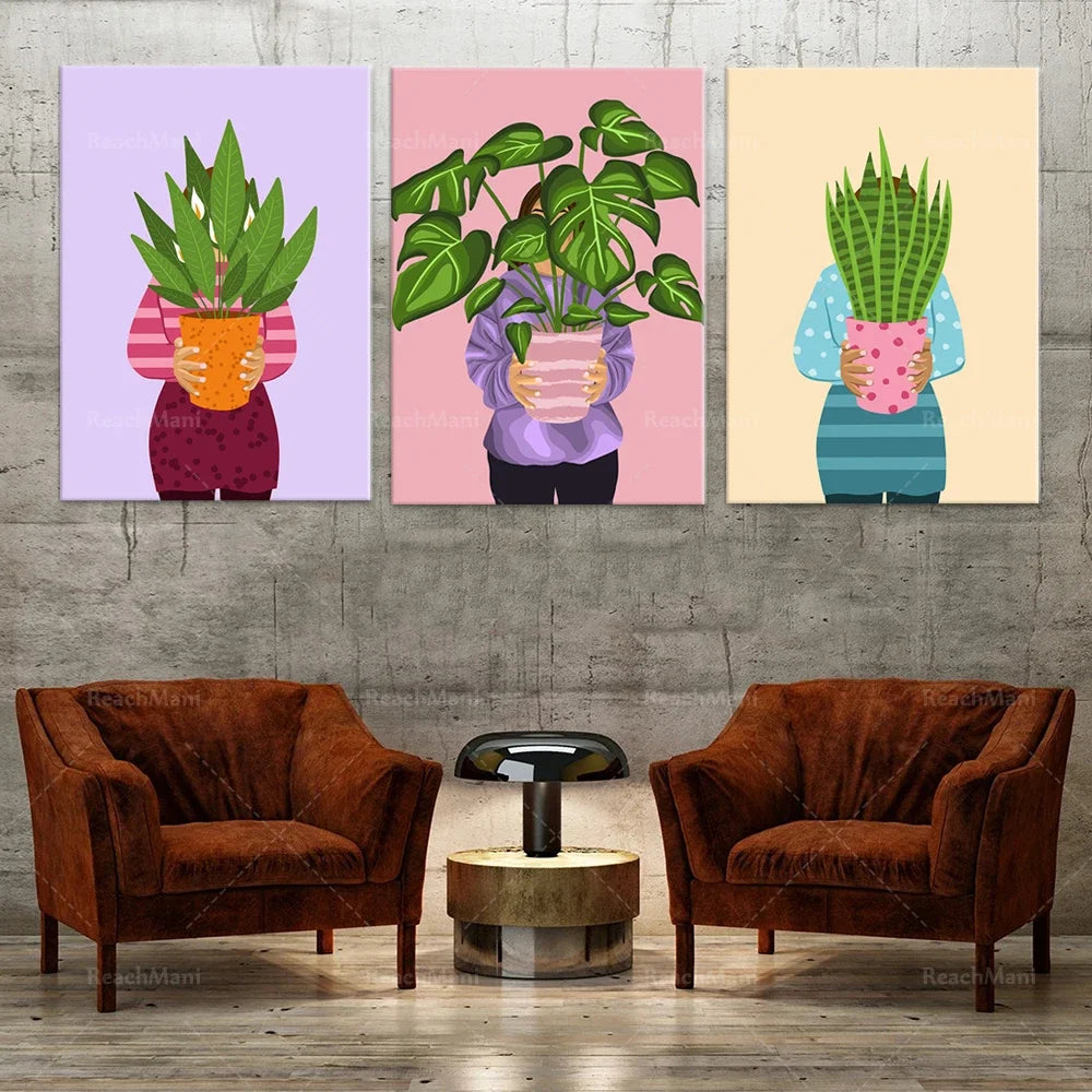 Trois affiches aux designs colorés représentant des plantes d'intérieur dans des pots décoratifs, ajoutant une touche de verdure et de charme à cette pièce.