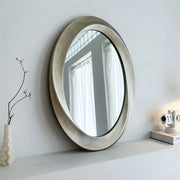 miroir ovale cadre doré texture rugueuse décoration classique élégante intérieure neutre fixé mur