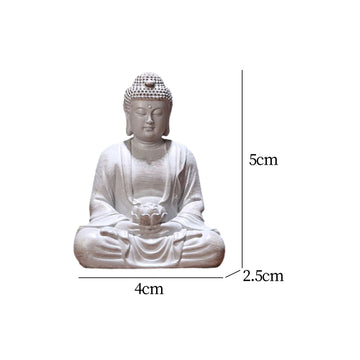statue bouddha zen blanc gris bois décoratif assiette cigarettes tapis fibres naturellements éléments divers