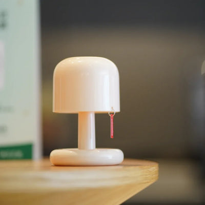 Lampe champignon coucher du soleil sur table de chevet
