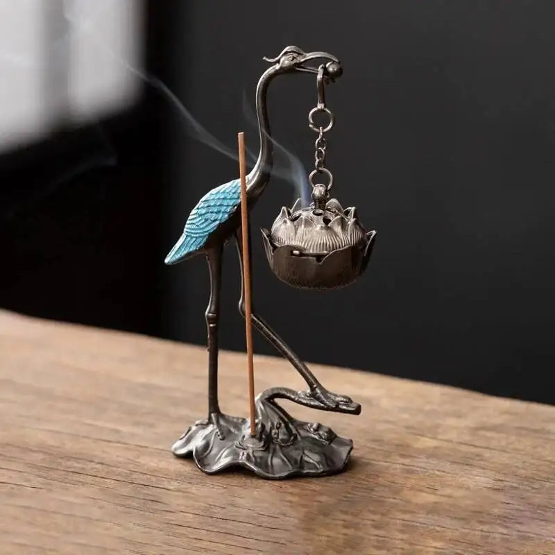 statuette oiseau or noir bleu artisanal élégant décoration maison motif floral support métal