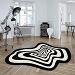 tapis noir blanc moderne abstrait rayures concentriques effet ondulé salon intérieur