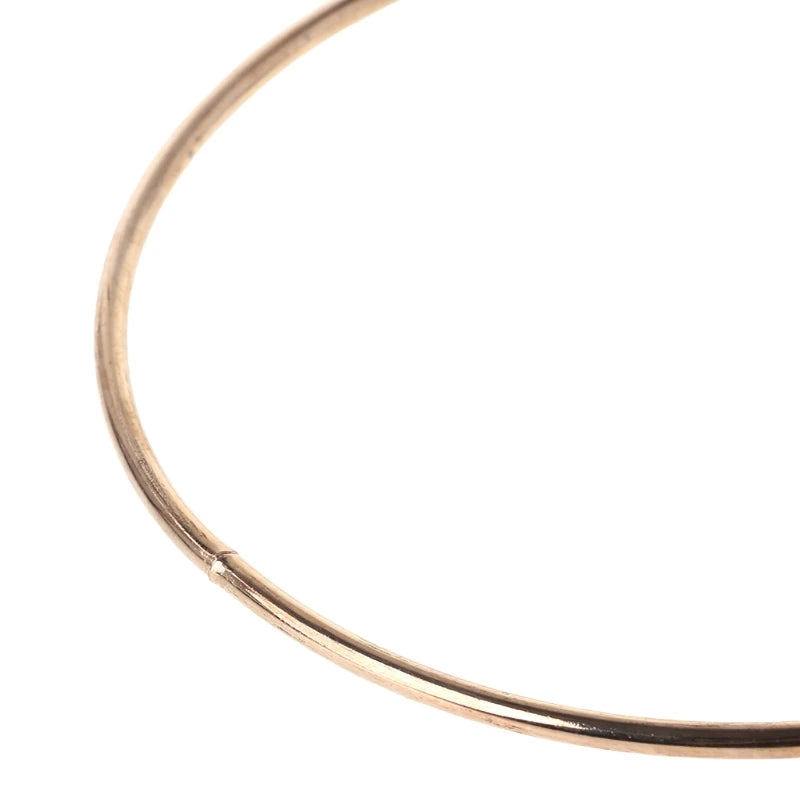 anneaux suspension dorés ronds concentriques métal opaques tailles variées moderneintérieurcoration minimaliste