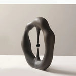 sculpture abstraite contemporaine blanc gris minimaliste texture mat forme organique noire central